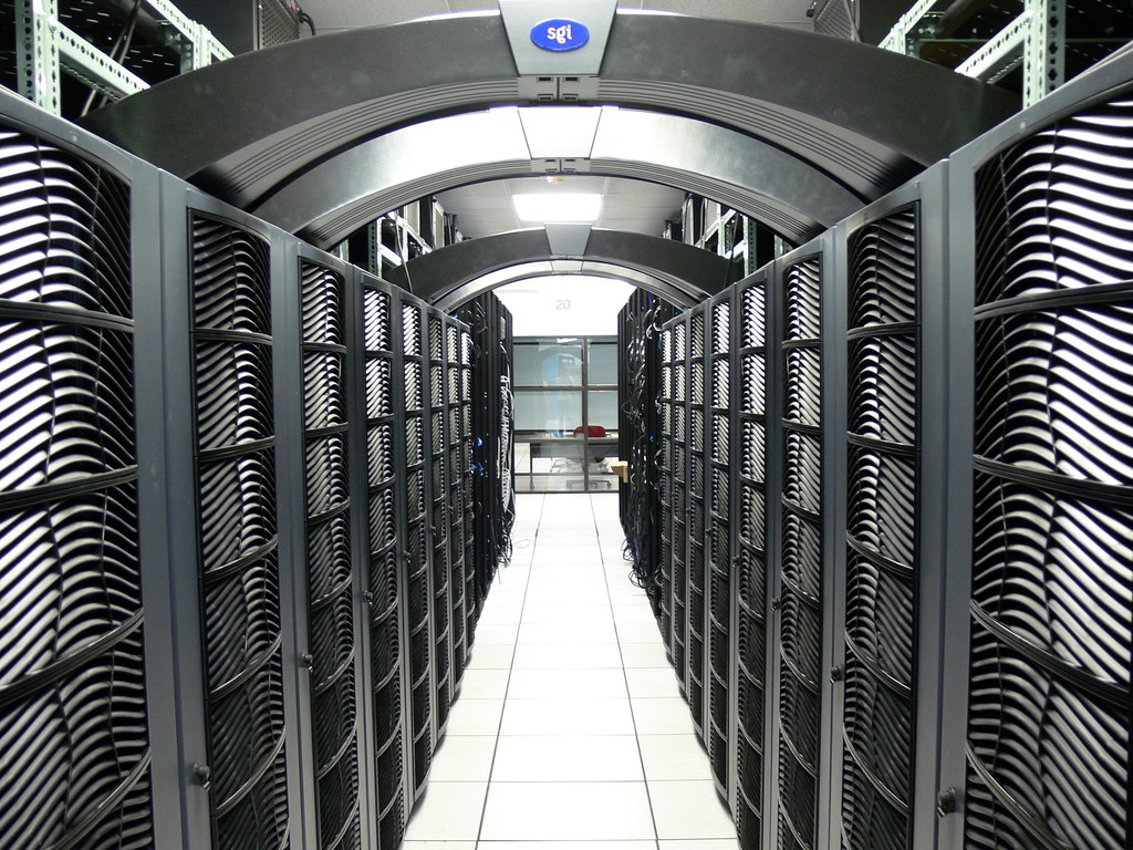 Rows of server racks in a production data center